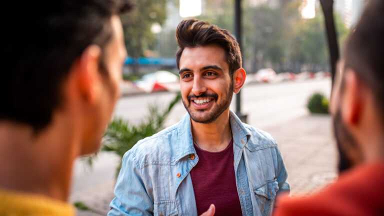 Man talking with friends about his new year new habit