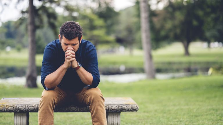 Man humbly praying.