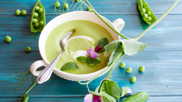 Pea and mint soup set on a table for a green lent