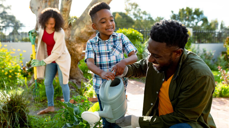 Family working in their garden together for their spring activity